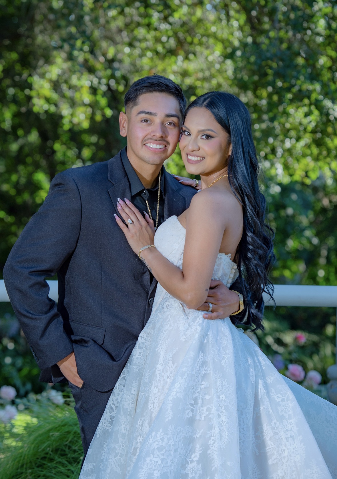 Couple in formal attire in a garden