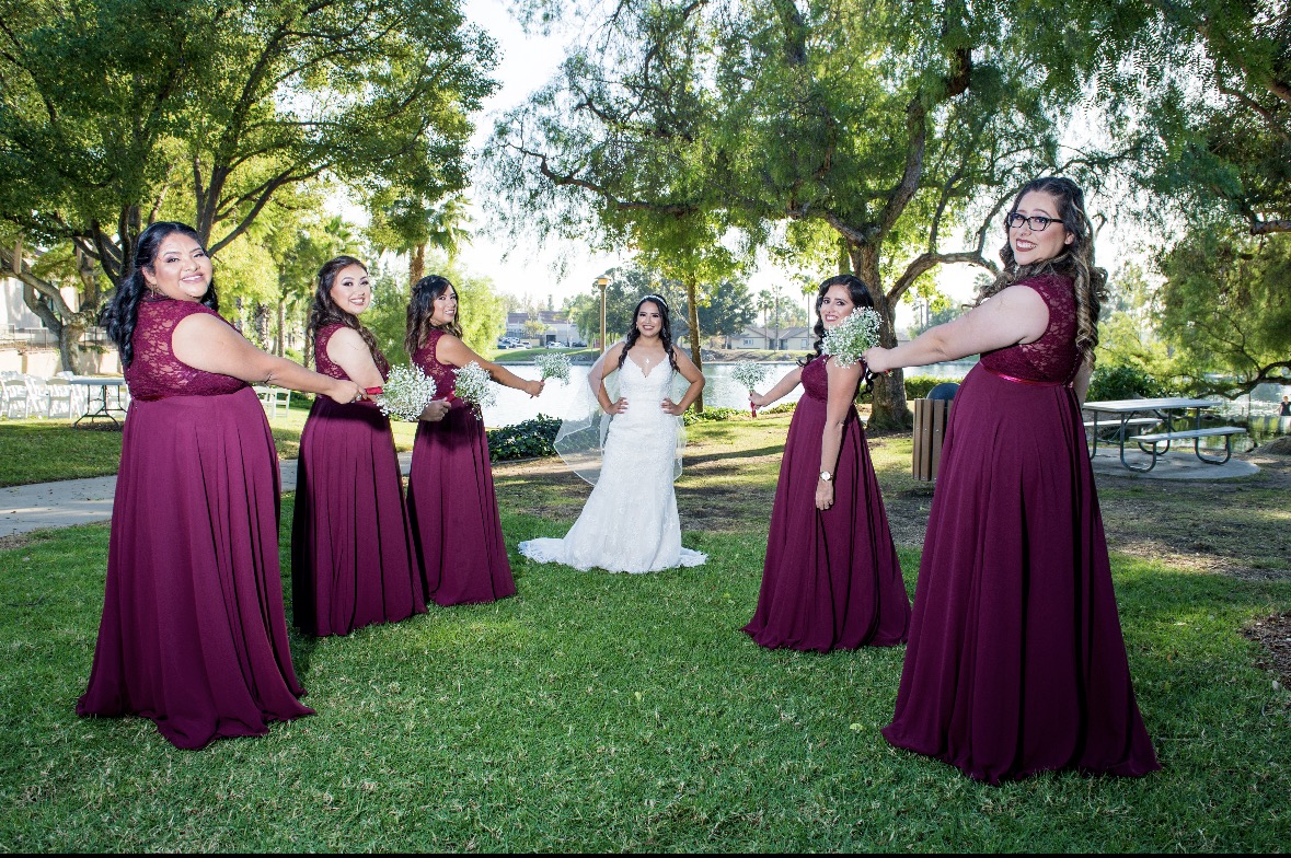 Bride with bridesmaids in burgundy gowns